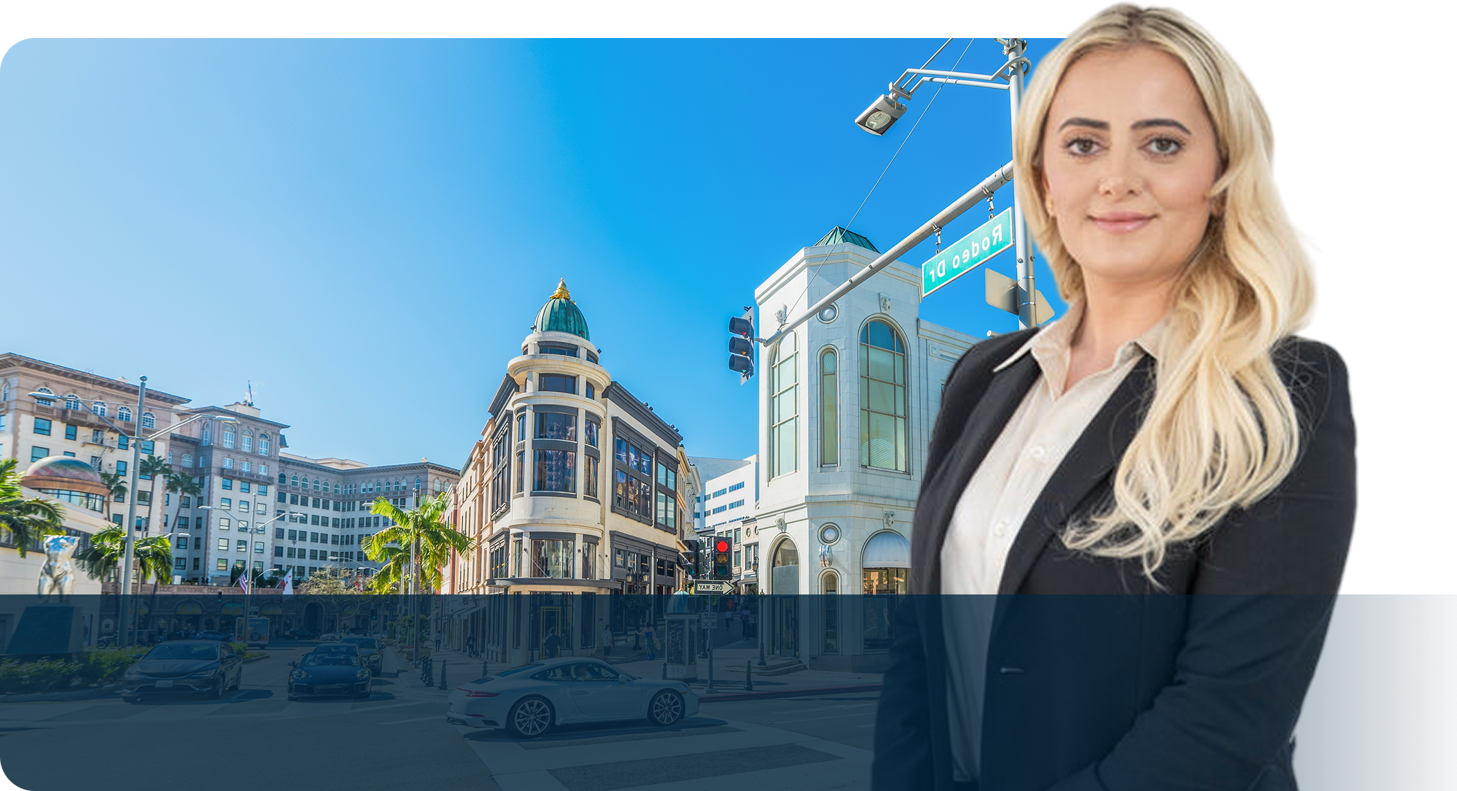 A woman in business attire standing on the side of a street.