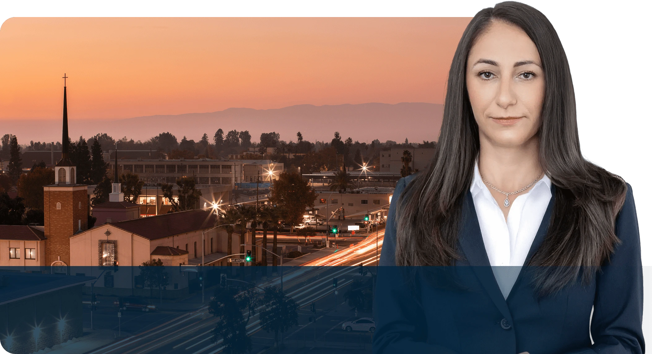 A woman standing in front of a city skyline.