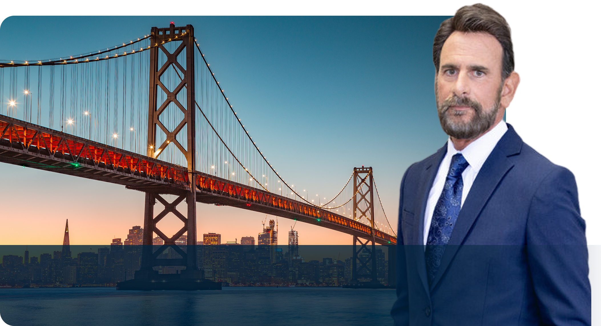 A man in a suit standing next to the bridge.